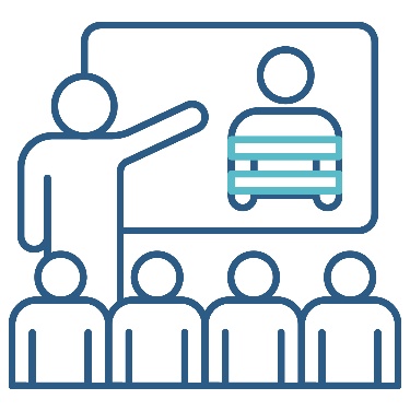 A person presenting to a group of people. They are pointing to a white board that shows a restrictive practices icon.