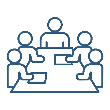 A group of people sitting at a desk.