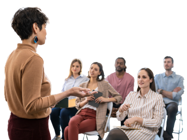 A person presenting to a group of people.