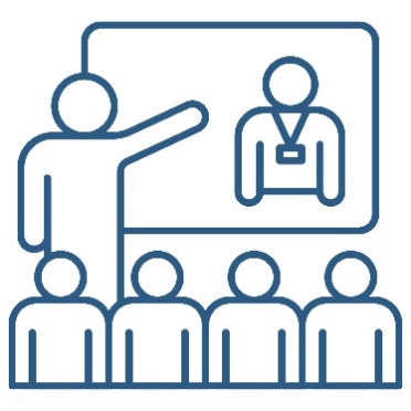 A person presenting to a group of people. They are pointing to a white board that shows a provider.