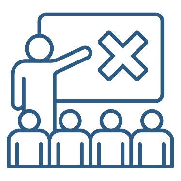 A person presenting to a group of people. They are pointing to a white board that shows a cross on it.