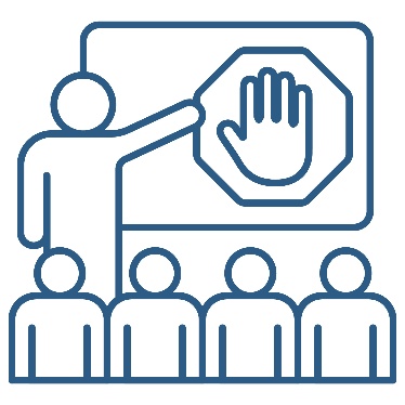 A person presenting to a group of people. They are pointing to a white board that shows a stop icon.