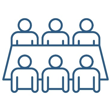 A group of people at a desk.