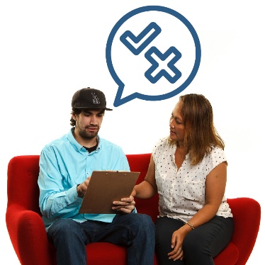 Someone supporting a person to read a document. There is a speech bubble above them with a tick and a cross inside of it.