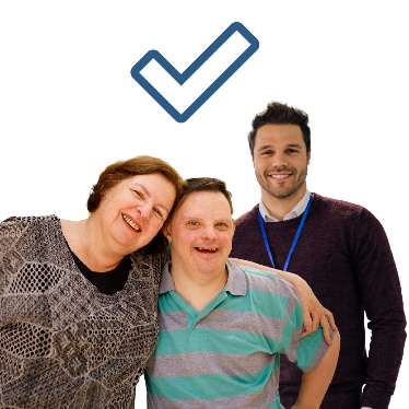 A practitioner with a person and someone who supports them. There is a tick above them.