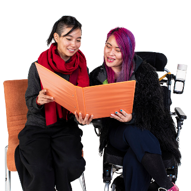 2 people looking at a document together.