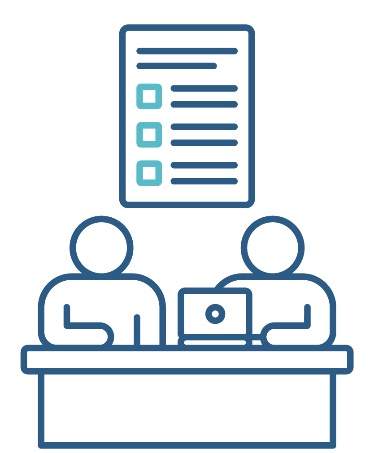 A document above 2 people at a desk. One is using a computer.