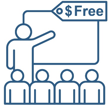 A person presenting to a group of people. They are pointing to a white board that has a tag saying 'Free' above.